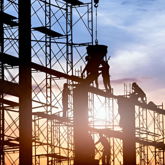 Workers on scaffolding structure